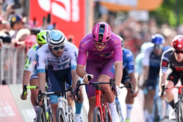 LUCCA, ITALY - MAY 08: (L-R) Phil Bauhaus of Germany and Team Bahrain - Victorious, Jonathan Milan of Italy and Team Lidl - Trek - Purple Points Jersey and Caleb Ewan of Australia and Team Jayco AlUla sprint at finish line during the 107th Giro d