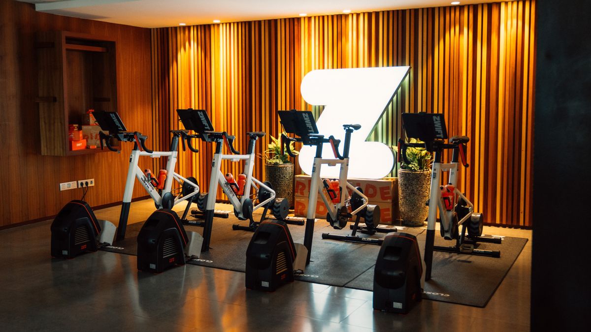 Three Zwift Ride trainers at the Zwift Community live event