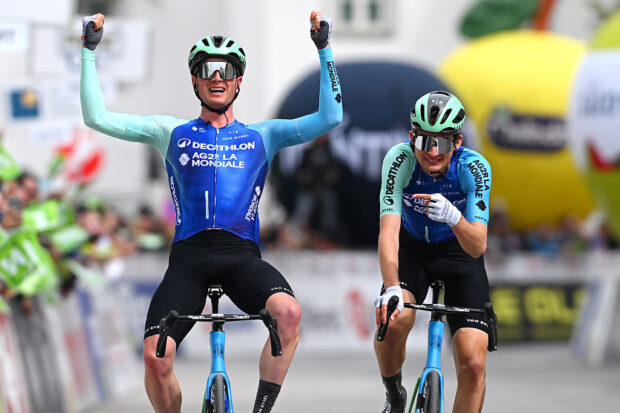 Teammates Nicolas Prodhomme and Paul Seixas crossing the finish line on stage 5 at the Tour of the Alps