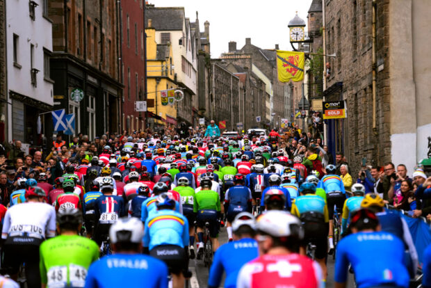 GLASGOW SCOTLAND AUGUST 06 A general view of the peloton passing through a landscape during the 96th UCI Cycling World Championships Glasgow 2023 Men Elite Road Race a 2711km one day race from Edinburgh to Glasgow UCIWT on August 06 2023 in Glasgow Scotland Photo by Alex Broadway UCI PoolGetty Images