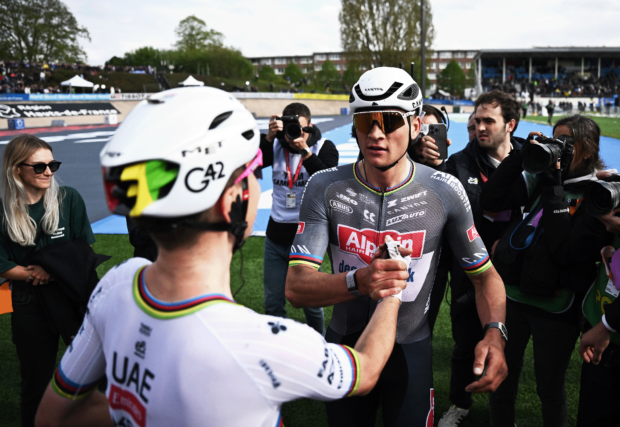 ROUBAIX, FRANCE - APRIL 13: (L-R) Tadej Pogacar of Slovenia and UAE Team Emirates - XRG and race winner Mathieu Van Der Poel of Netherlands and Team Alpecin - Deceuninck react after the 122nd Paris - Roubaix 2025 a 259.2km one day race from Compiegne to Roubaix / #UCIWT / on April 13, 2025 in Roubaix, France. (Photo by Jeff Pachoud - Pool/Getty Images)