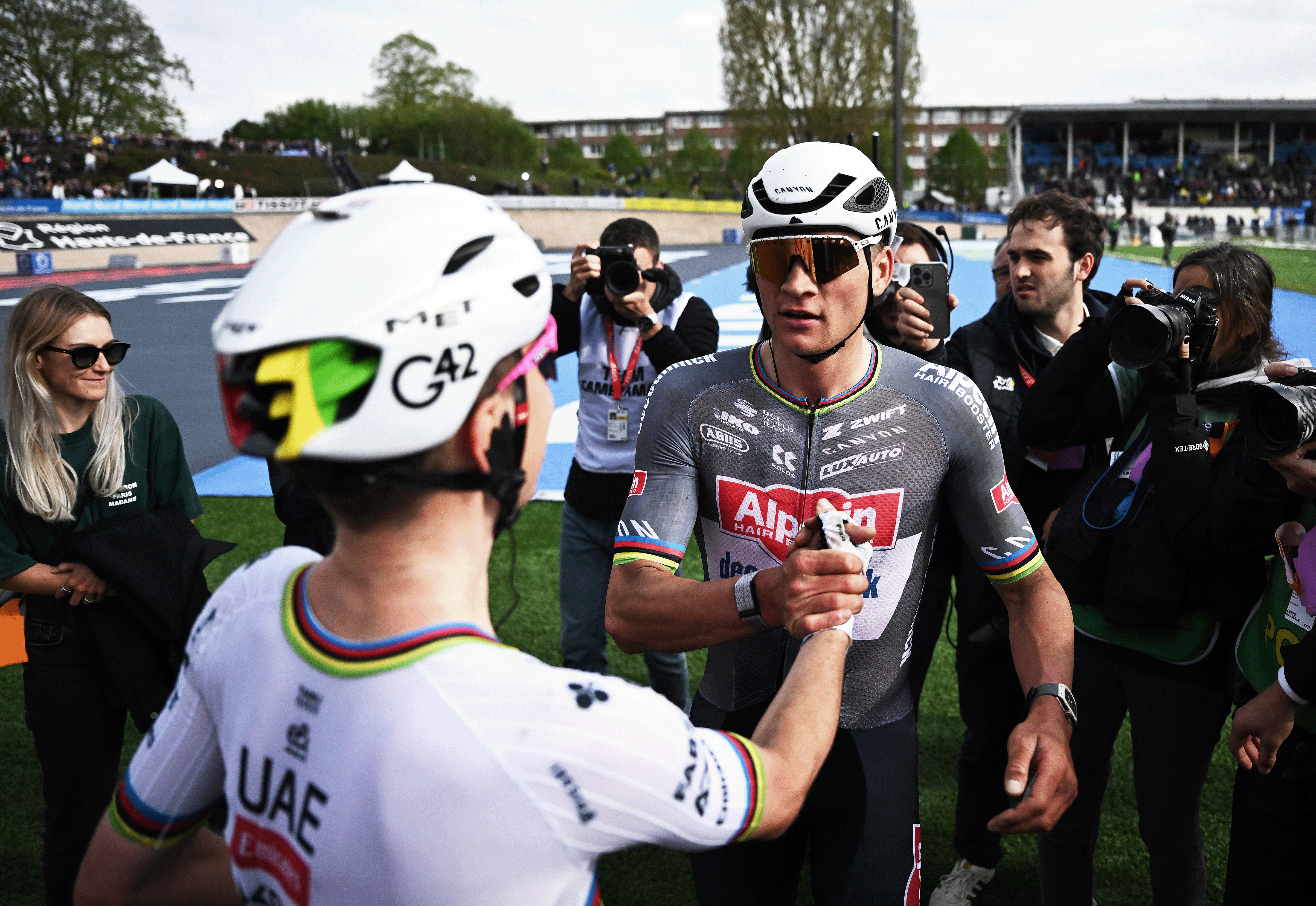 ROUBAIX, FRANCE - APRIL 13: (L-R) Tadej Pogacar of Slovenia and UAE Team Emirates - XRG and race winner Mathieu Van Der Poel of Netherlands and Team Alpecin - Deceuninck react after the 122nd Paris - Roubaix 2025 a 259.2km one day race from Compiegne to Roubaix / #UCIWT / on April 13, 2025 in Roubaix, France. (Photo by Jeff Pachoud - Pool/Getty Images)