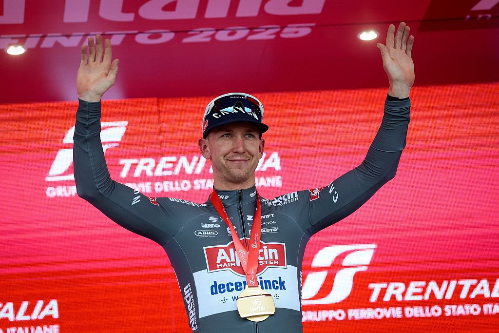 Alpecin's Australian rider Kaden Groves celebrates on the podium after victory in the 6th stage of the 108th Giro d'Italia cycling race 227kms from Potenza to Naples on May 15, 2025. (Photo by Luca Bettini / AFP)