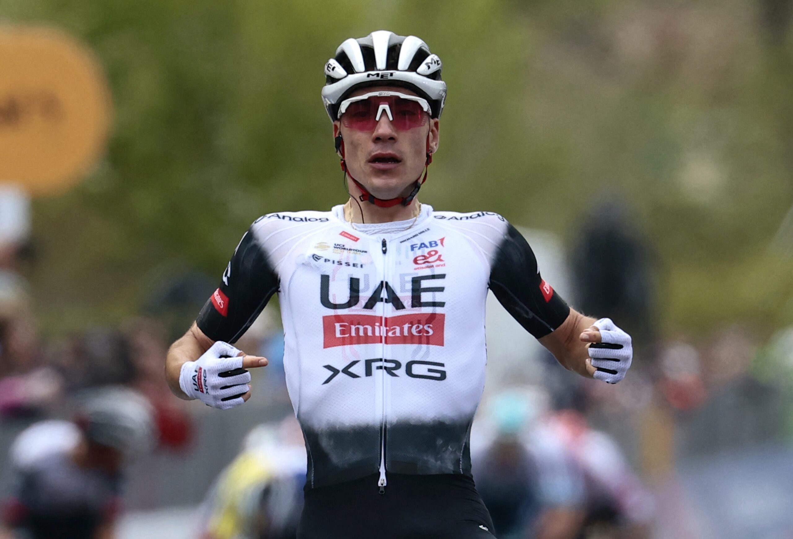 Juan Ayuso celebrates for his UAE Team Emirates-XRG squad as he crosses the Giro d'Italia stage 7 finish with his first Grand Tour stage victory