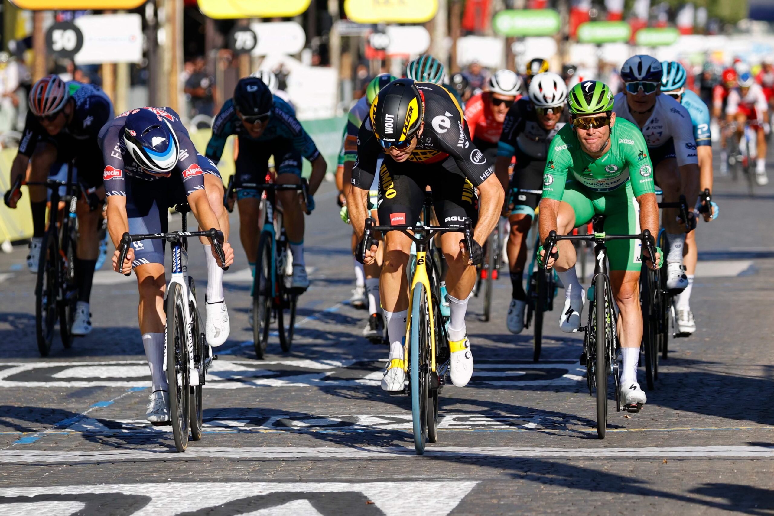 Wout van Aert wins the sprint on the Champs-Elysées at the 2021 Tour de France ahead of Jasper Philipsen and Mark Cavendish
