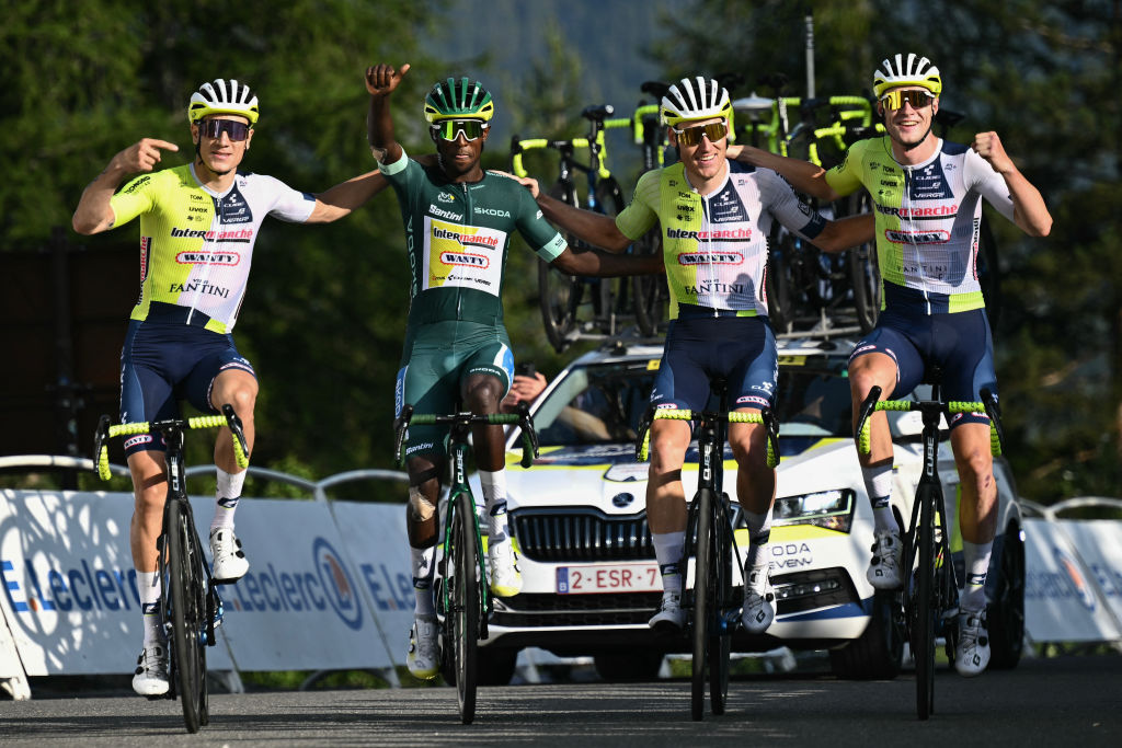 Intermarche - Wanty team's Eritrean rider Biniam Girmay wearing the sprinter's green jersey celebrates as he cycles to the finish line with his teammates during the 20th stage of the 111th edition of the Tour de France cycling race, 132,8 km between Nice and Col de la Couillole, southeastern France, on July 20, 2024. (Photo by Marco BERTORELLO / AFP) (Photo by MARCO BERTORELLO/AFP via Getty Images)