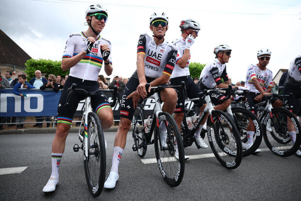 UAE Team Emirates' Slovenian rider Tadej Pogacar (L) waits with teammates prior to the start of the 1st stage of the 77th edition of the Criterium du Dauphine cycling race, 195,8 km between Domérat and Montlucon, on June 8, 2025. (Photo by Anne-Christine POUJOULAT / AFP) (Photo by ANNE-CHRISTINE POUJOULAT/AFP via Getty Images)