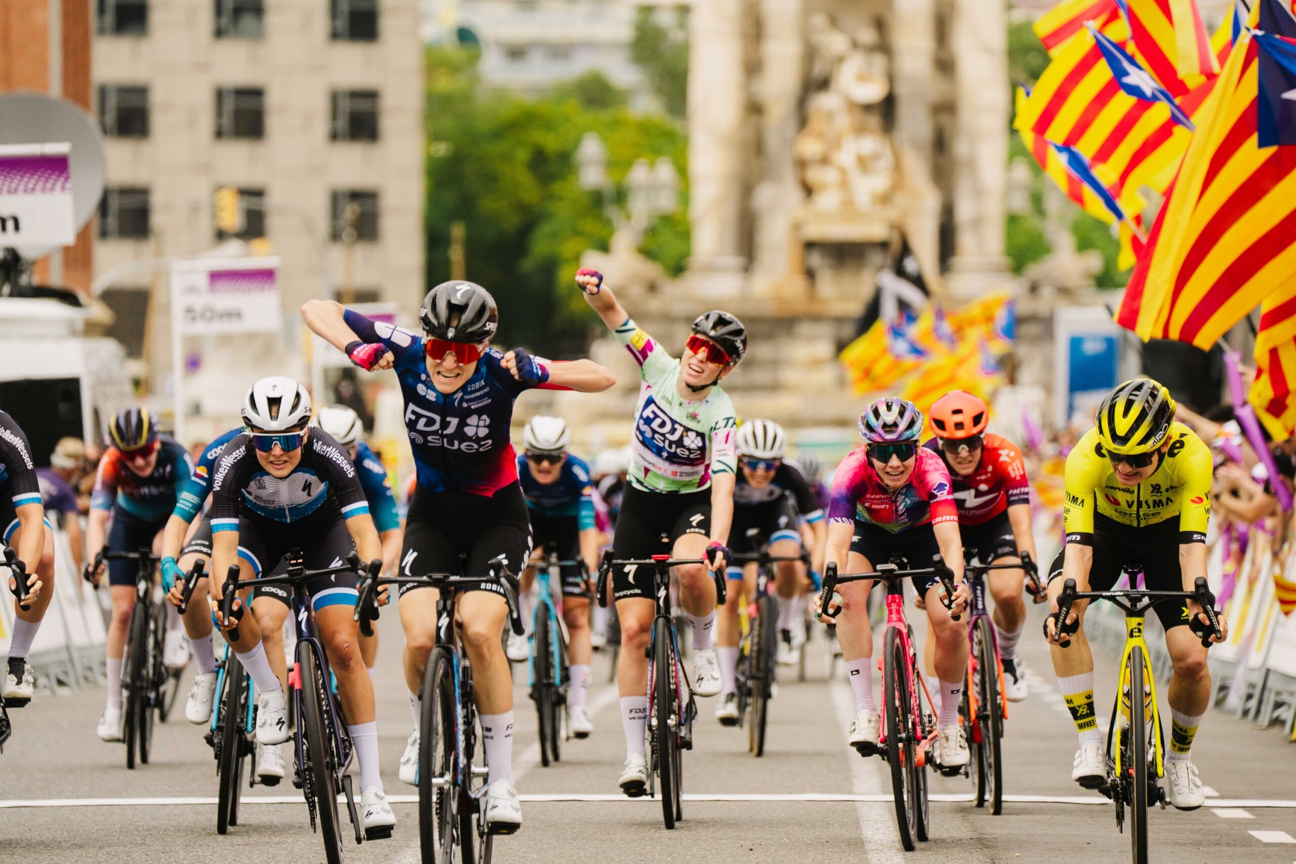 Loes Adegeest (FDJ-SUEZ) wins stage 3 of the Volta a Catalunya Feminas as overall winner Demi Vollering celebrates behind her