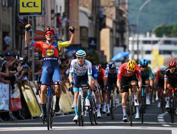 Fred Wright of Bahrain Victorious follows Jonathan Milan of Lidl-Trek across finish line into Issoire
