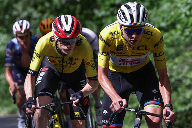 Team Visma - Lease a Bike's Danish rider Jonas Vingegaard (Centre L) and UAE Team Emirates XRG's Slovenian rider Tadej Pogaar wearing the overall leader's yellow jersey cycle during the 7th stage of the 77th edition of the Criterium du Dauphine cycling race, 131,6 km between Grand-Aigueblanche and Valmeinier, on June 14, 2025. (Photo by Anne-Christine POUJOULAT / AFP) (Photo by ANNE-CHRISTINE POUJOULAT/AFP via Getty Images)
