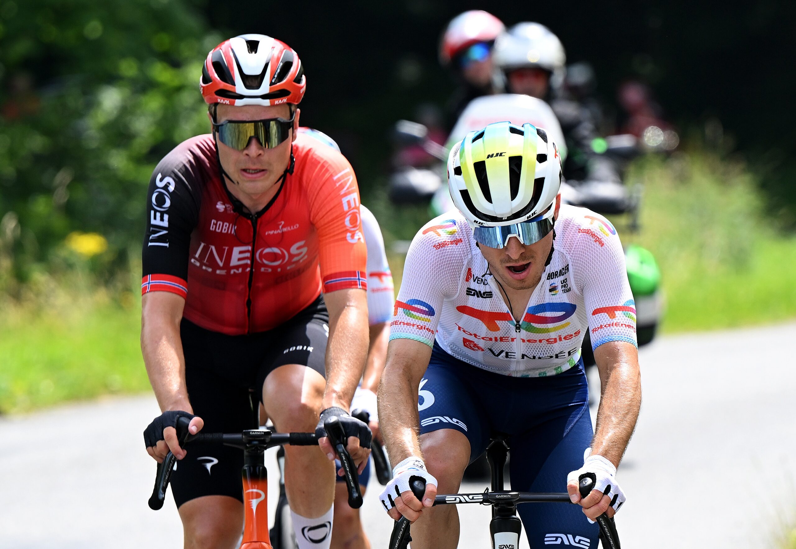 MACON, FRANCE - JUNE 12: (L-R) Tobias Foss of Norway and Team INEOS Grenadiers and Matteo Vercher of France and Team TotalEnergies compete in the chase group during the 77th Criterium du Dauphine 2025, Stage 5 a 183km stage from Saint-Priest to Macon / #UCIWT / on June 12, 2025 in Macon, France. (Photo by Dario Belingheri/Getty Images)