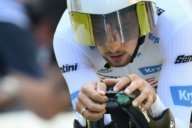 Arkea-B&amp;B Hotels team's French rider Kevin Vauquelin wearing the best young rider's white jersey cycles to the finish line of the 5th stage of the 112th edition of the Tour de France cycling race, 33 km individual time trial starting and finishing in Caen, northwestern France, on July 9, 2025. (Photo by Marco BERTORELLO / AFP) (Photo by MARCO BERTORELLO/AFP via Getty Images)