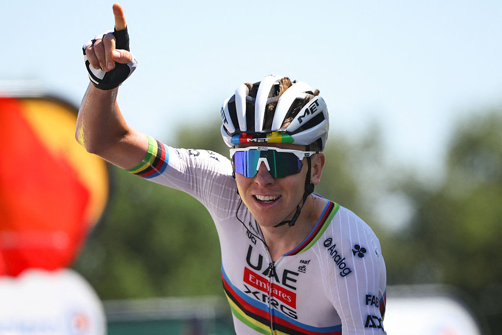 UAE Team Emirate - XRG team's Slovenian rider Tadej Pogacar cycles to the finish line to win the 7th stage of the 112th edition of the Tour de France cycling race, 197 km between Saint-Malo and Mur-de-Bretagne Guerledan, in Brittany, western France, on July 11, 2025. (Photo by Anne-Christine POUJOULAT / AFP)