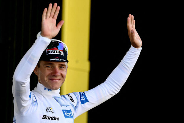 Remco Evenepoel celebrates on the podium with the best young rider's white jersey after the 5th stage of the 112th edition of the Tour de France cycling race, 33 km individual time trial starting and finishing in Caen