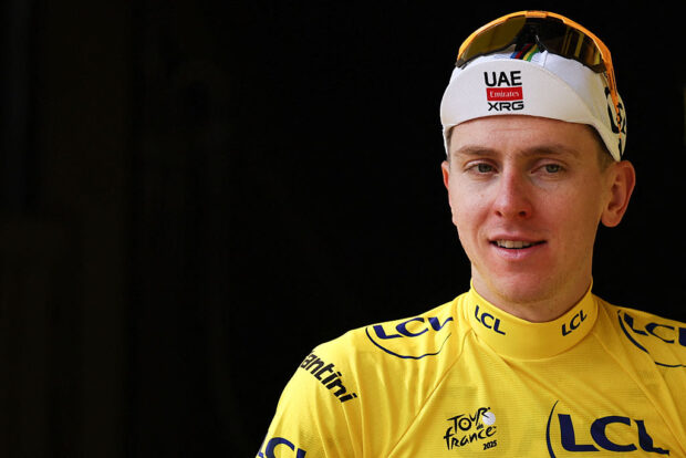 UAE Team Emirates - XRG team's Slovenian rider Tadej Pogacar celebrates on the podium with the overall leader's yellow jersey after the 15th stage of the 112th edition of the Tour de France cycling race, 169.3 km between Muret and Carcassonne, southwestern France, on July 20, 2025. (Photo by Anne-Christine POUJOULAT / AFP)