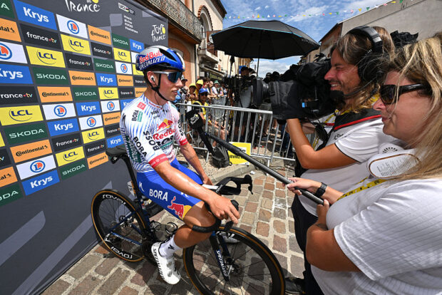 Laurence Pithie being interviewed at the Tour de France