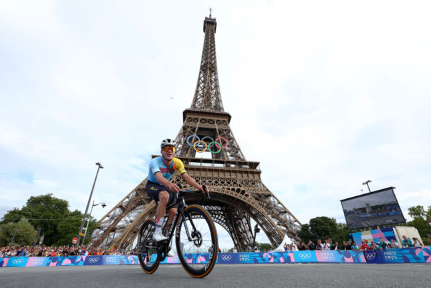 PARIS, FRANCE - AUGUST 03: Gold medalist winner Remco Evenepoel of Team Belgium celebrates with the Eiffel Tower in the background during the Men's Road Race on day eight of the Olympic Games Paris 2024 at trocadero on August 03, 2024 in Paris, France. (Photo by Buda Mendes/Getty Images)