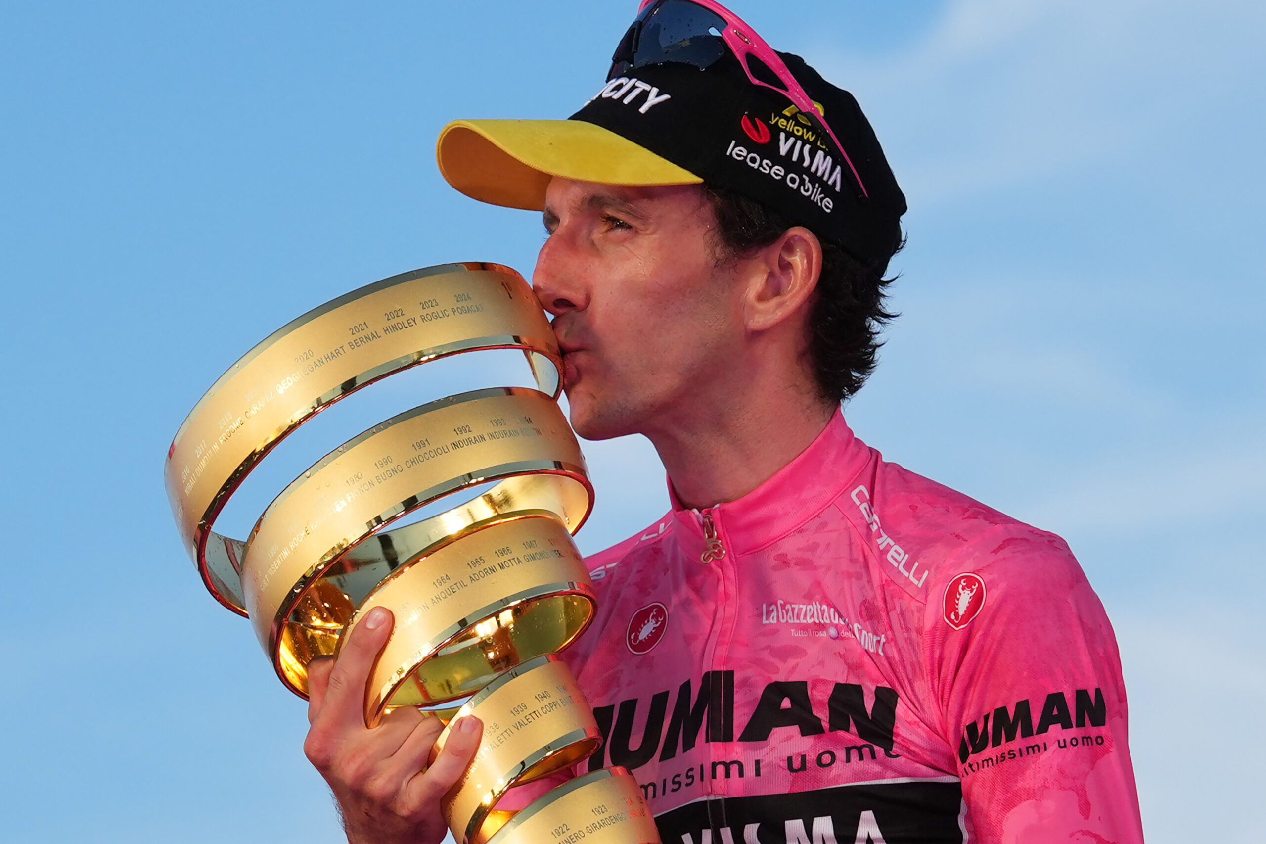 Britain's Simon Philip Yates on the podium, wearing the pink jersey of the race overall leader, celebrates after winning the 21th stage of the Giro d'Italia 2025 cycling race in Rome, Italy - Sunday, June 01, 2025. Sport - cycling. (Photo by Gian Mattia D'Alberto/LaPresse)