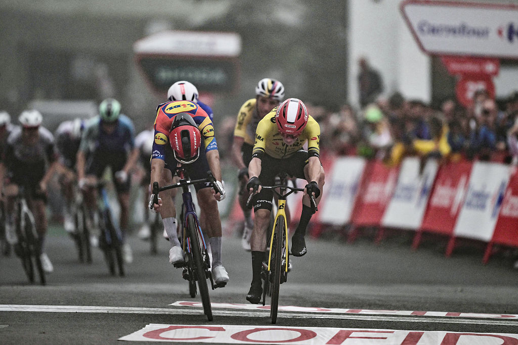 Team Visma-Lease a bike's Danish rider Jonas Vingegaard (R) crosses the finish line to win ahead of Team Lidl-Trek's Italian rider Giulio Ciccone (L) during the second stage of the Vuelta a Espana, a 159,6 km race between Alba and Limone Piemonte, in Italy's Piemonte region, on August 24, 2025. (Photo by Marco Bertorello / AFP)