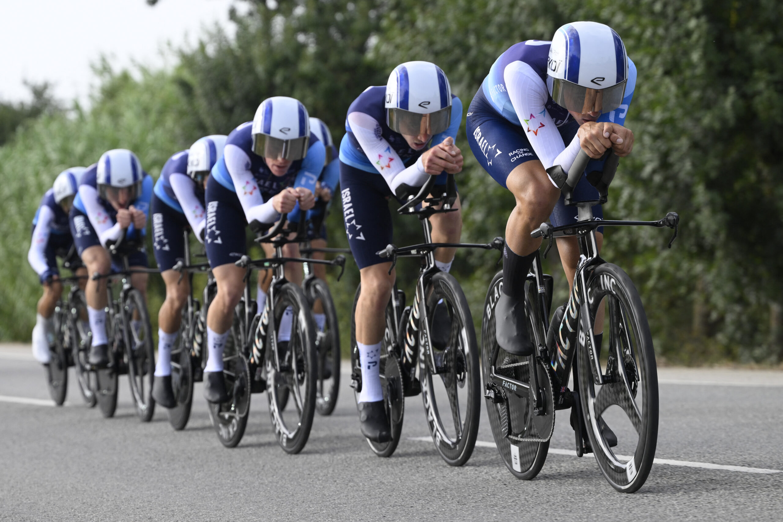 Team Israel Premier Tech 's riders compete during the fifth stage of La Vuelta a Espana cycling tour, a 24.1 km time-trial team race in Figueres, on August 27, 2025. (Photo by Josep LAGO / AFP)