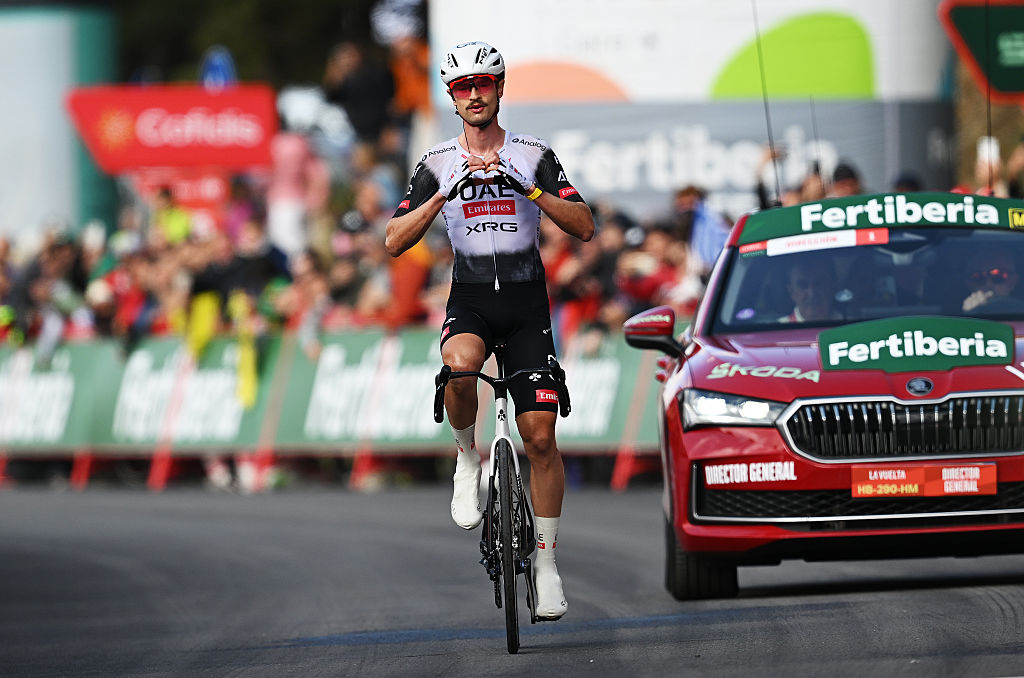 Jay Vine displays 'heart hands' while riding to the win on stage 6 of the Vuelta a Espana