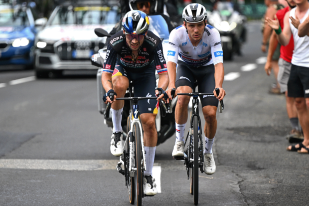 LE-LIORAN, FRANCE - JULY 10: (L-R) Primoz Roglic of Slovenia and Team Red Bull – BORA – hansgrohe and Remco Evenepoel of Belgium and Team Soudal Quick-Step - White best young jersey compete during the 111th Tour de France 2024, Stage 11 a 211km stage from Evaux-les-Bains to Le Lioran (1239m) / #UCIWT / on July 10, 2024 in Le Lioran, France. (Photo by Tim de Waele/Getty Images)