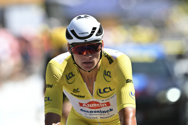 Alpecin - Deceuninck team's Dutch rider Mathieu van der Poel wearing the overall leader's yellow jersey cycles across the finish line cycles during the 7th stage of the 112th edition of the Tour de France cycling race, 197 km between Saint-Malo and Mur-de-Bretagne Guerledan, in Brittany, western France, on July 11, 2025. (Photo by Loic VENANCE / AFP) (Photo by LOIC VENANCE/AFP via Getty Images)
