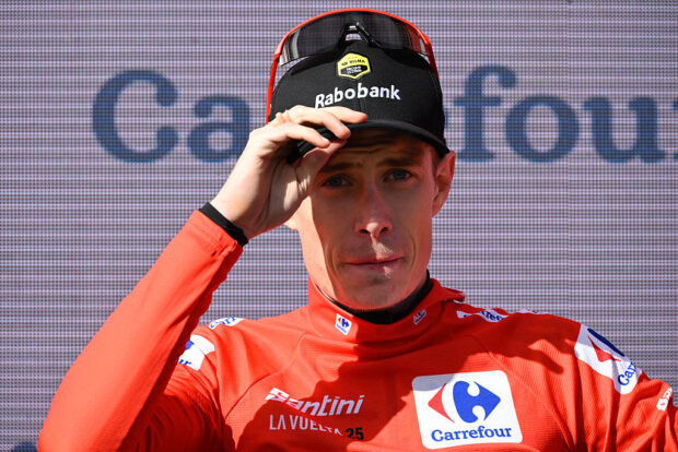 Overall race leader red jersey holder Team Visma-Lease a bike's Danish rider Jonas Vingegaard reacts on the podium after the 17th stage of the Vuelta a Espana, a 143 km race between O Barco de Valdeorras and Alto de El Morredero, Ponferrada, on September 10, 2025. (Photo by Miguel RIOPA / AFP)
