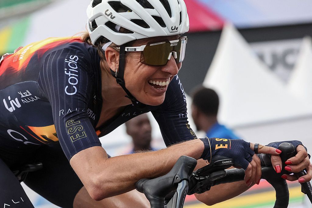 Spanish rider Margarita Victoria Garcia Canellas celebrates after crossing the finish line to place third in the women's Elite road race cycling event during the UCI 2025 Road World Championships, in Kigali, on September 27, 2025. (Photo by Anne-Christine POUJOULAT / AFP)