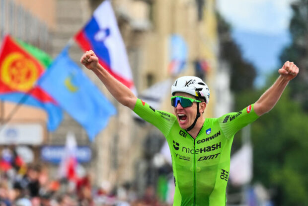 Slovenia's Tadej Pogacar celebrates as he crosses the finish line to win the men's Elite Road Race cycling event during the UCI 2024 Road World Championships, in Zurich, on September 29, 2024. (Photo by Fabrice COFFRINI / AFP)