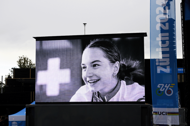 ZURICH, SWITZERLAND - SEPTEMBER 27: The screen shows cyclist Muriel Furrer, who sadly passed away after suffering a severe head injury at the UCI Paracycling and Road World Championships 2024during the 97th UCI Cycling World Championships Zurich 2024, Men's U23 Road Race a 173.6km one day race from Uster to Zurich on September 27, 2024 in Zurich, Switzerland. (Photo by Dario Belingheri/Getty Images)