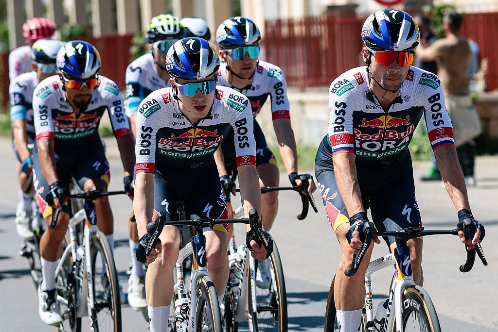 Red Bull-Bora-Hansgrohe's Slovenian rider Primoz Roglic (R) rides ahead of teammates during the 4th stage of the 108th Giro d'Italia cycling race 189kms from Alberobello to Lecce on May 13, 2025. (Photo by Luca Bettini / AFP)