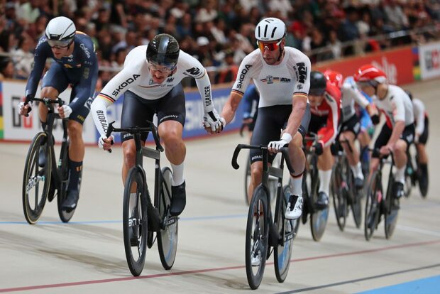 Germany's #21 Moritz Augenstein (L) and #22 Roger Kluge compete in the men's madison 50km event final at the 2025 UCI Track World Championships, in the Penalolen Velodrome in Santiago, on October 26, 2025. (Photo by Javier TORRES / AFP)