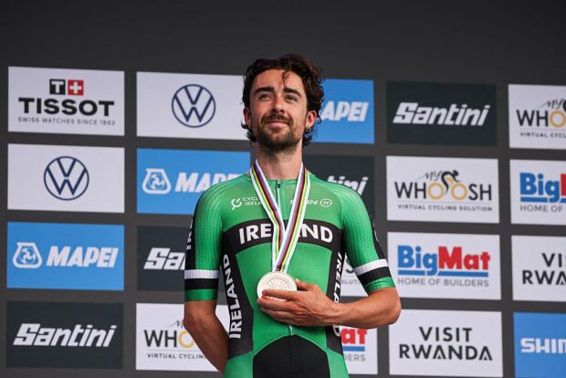 Bronze medallist Irish rider Ben Healy poses on the podium following the men's Elite road race cycling event during the UCI 2025 Road World Championships, in Kigali, on September 28, 2025. (Photo by Anne-Christine POUJOULAT / AFP)