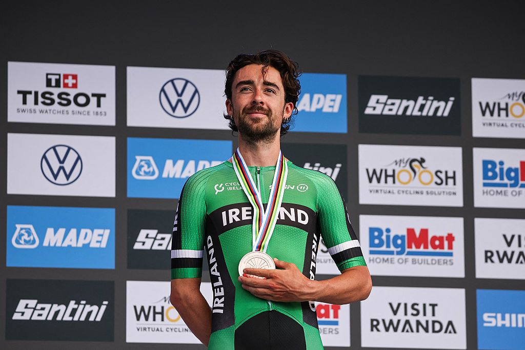 Bronze medallist Irish rider Ben Healy poses on the podium following the men's Elite road race cycling event during the UCI 2025 Road World Championships, in Kigali, on September 28, 2025. (Photo by Anne-Christine POUJOULAT / AFP)