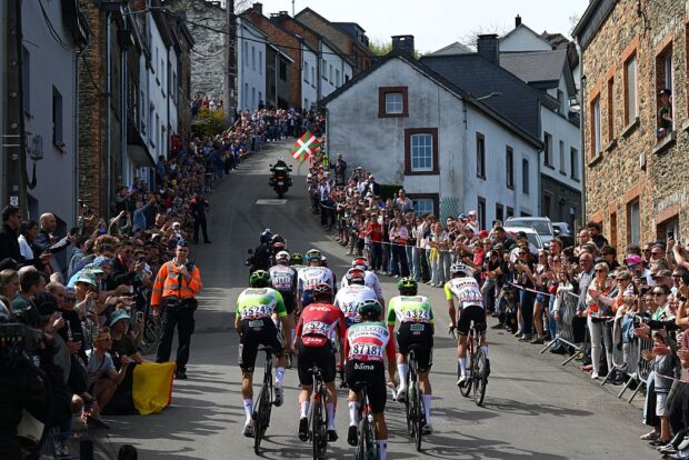 Riders from several teams race uphill during Liege-Bastogne-Liege