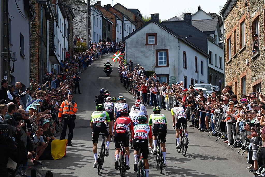 Riders from several teams race uphill during Liege-Bastogne-Liege