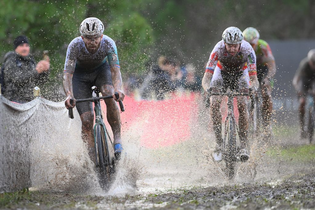 Dutch Joris Nieuwenhuis and Belgian Michael Vanthourenhout pictured in action during the men's elite race of the Cyclocross World Cup, in Terralba, Sardinia, Italy, Sunday 07 December 2025, stage 3 (out of 12) in the World Cup of the 2026-2027 season.BELGA PHOTO DAVID PINTENS (Photo by DAVID PINTENS / BELGA MAG / Belga via AFP)