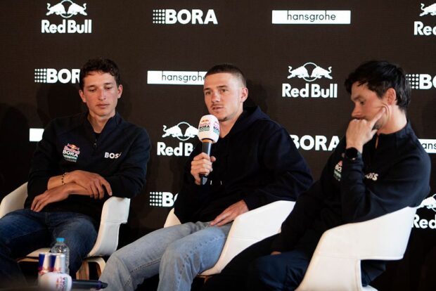 (From L) Red Bull–Bora–Hansgrohe’s German rider Florian Lipowitz, Belgian rider Remco Evenepoel and Slovenian rider Primoz Roglic attend a press conference in the media day of their new team in Binissalem on Mallorca Island on December 10, 2025. (Photo by Jaime REINA / AFP)