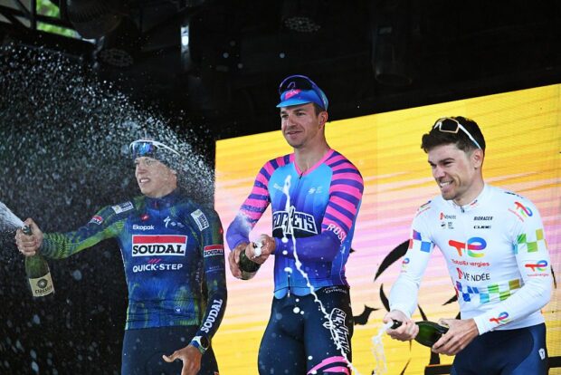 VALENCIA, SPAIN - JANUARY 25: (L-R) Paul Magnier of France and Team Soudal Quick-Step Devo on second place, race winner Dylan Groenewegen of Netherlands and Team Unibet Rose Rockets and Emilien Jeanniere of France and Team TotalEnergies on third place pose on the podium ceremony after the 42nd Classica Comunitat Valenciana 1969 - Gran premio Valencia 2026 a 200km one day race from La Nucia to Valencia on January 25, 2026 in Valencia, Spain. (Photo by Antonio Baixauli/Getty Images)