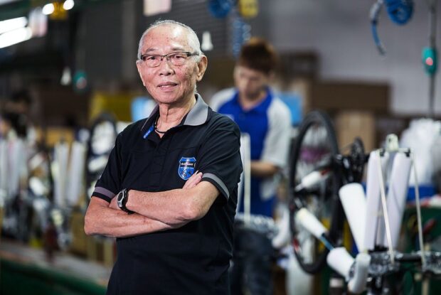 King Liu, chairman of Giant Manufacturing Co., poses for a photograph at the company's bicycle factory in Taichung, Taiwan, on Thursday, Oct. 22, 2015. Liu, Giant Group's 81-year-old founder and chairman, will retire in 2017 from the world's biggest bicycle empire he founded more than four decades ago. Photographer: Maurice Tsai/Bloomberg via Getty Images