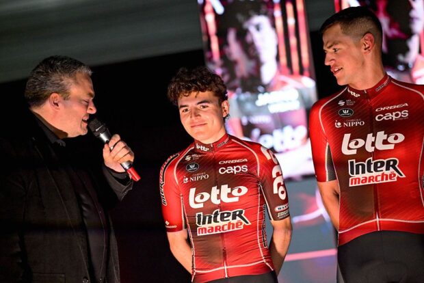 Lotto-Intermarche's Belgian rider Jarno Widar (C) looks on as he attends the Lotto-Intermarche cycling team presentation in Temse on January 12, 2026. (Photo by DIRK WAEM / Belga / AFP) / Belgium OUT
