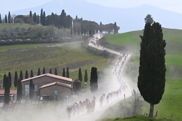 SIENA, ITALY - MARCH 08: A general view of the peloton passing through a landscape during the 19th Strade Bianche 2025, Men&amp;apos;s Elite a 213km one day race from Siena to Siena 320m / #UCIWT / on March 08, 2025 in Siena, Italy. (Photo by Tim de Waele/Getty Images)
