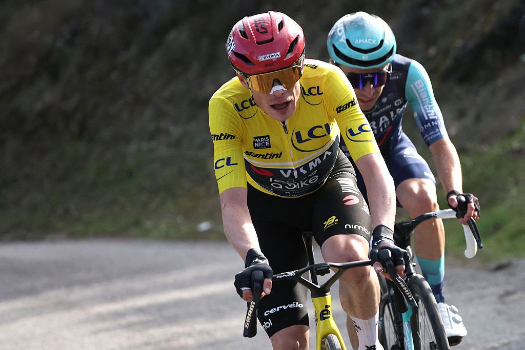 Team Visma - Lease a Bike's Danish rider Jonas Vingegaard, wearing the overall leader yellow jersey, rides in a breakaway with Bahrain - Victorious' French rider Lenny Martinez (R) during the 8th and final stage of the Paris-Nice cycling race, 129.2 km between Nice and Nice, on March 15, 2026. (Photo by Anne-Christine POUJOULAT / AFP)