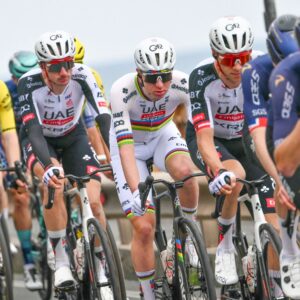 UAE Team Emirate's Slovenian rider Tadej Pogacar (C) rides in the pack during the 117th Milan - Sanremo one-day classic cycling race, on March 21, 2026. (Photo by Marco BERTORELLO / AFP via Getty Images)