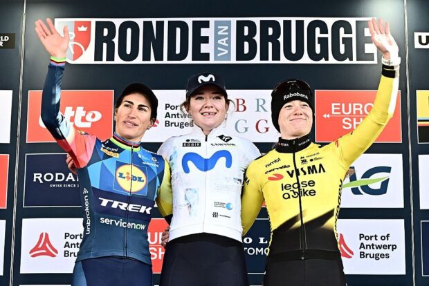 Runner-up Elisa Balsamo (Lidl-Trek) on the podium with winner Carys Lloyd (Movistar) and third-placed Nienke Veenhoven (Visma-Lease a Bike)