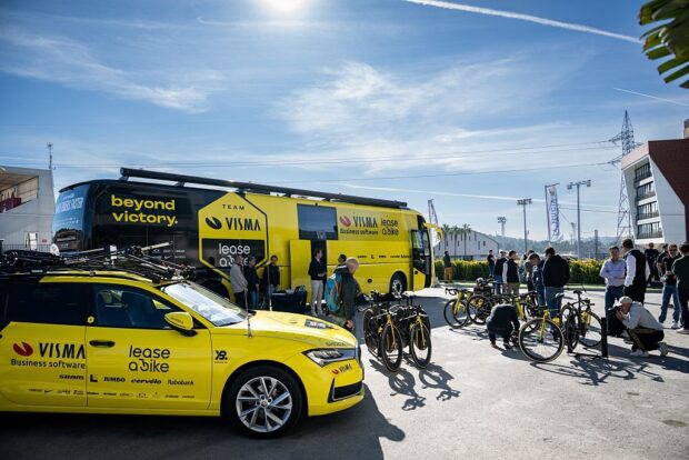 Visma-Lease a Bike team car and bus at a team presentation in January 2026