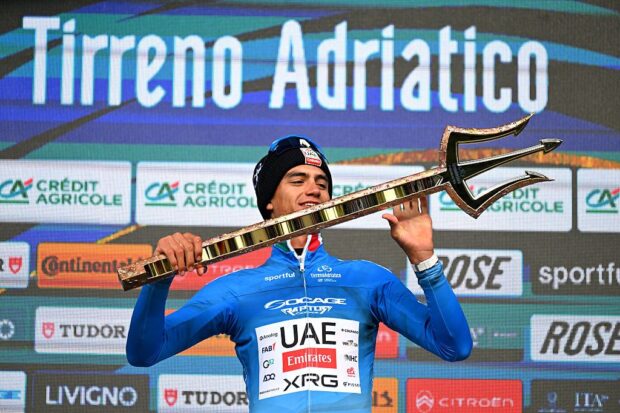 SAN BENEDETTO DEL TRONTO, ITALY - MARCH 15: Isaac Del Toro of Mexico and UAE Team Emirates - XRG celebrates at podium as Blue Leader Jersey winner with the Trident Race Trophy during the 61st Tirreno-Adriatico 2026, Stage 7 a 142km stage from Civitanova Marche to San Benedetto del Tronto / #UCIWT / on March 15, 2026 in San Benedetto del Tronto, Italy. (Photo by Tim de Waele/Getty Images)