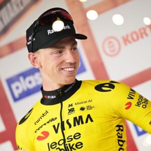 Great Britain's Matthew Brennan of Team Visma-Lease a Bike celebrates on the podium after winning the 78th edition of the men elite race of the Kuurne-Brussels-Kuurne one day cycling race, 195 km from Kuurne to Kuurne via Brussels, Sunday 01 March 2026. BELGA PHOTO DAVID PINTENS (Photo by DAVID PINTENS / BELGA MAG / Belga via AFP)