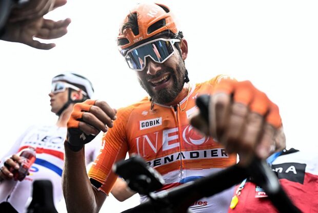 INEOS Grenadiers's Italian rider Filippo Ganna celebrates after winning the men's elite race of the Dwars door Vlaanderen cycling event, 184.6km from Roeselare to Waregem on April 1, 2026. (Photo by JASPER JACOBS / BELGA / AFP) / Belgium OUT